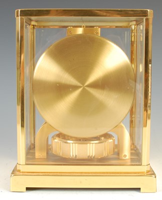 Lot 233 - A Jaeger-LeCoultre brass cased Atmos clock,...
