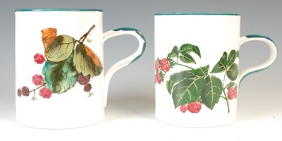 Lot 784 - Two Wemyss pottery mugs, one decorated with...
