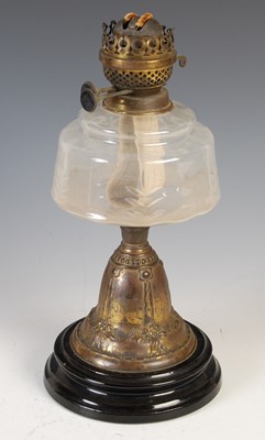 Lot 184 - A late 19th century brass oil lamp, with clear...