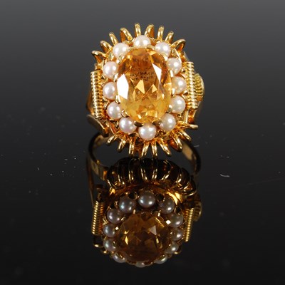 Lot 687 - An 18ct gold, pearl, and citrine ring watch by...