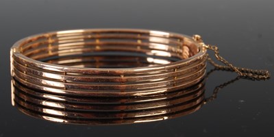 Lot 697 - An early 20th century yellow metal hinged...