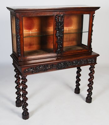 Lot 99 - A late 19th century rosewood display cabinet,...