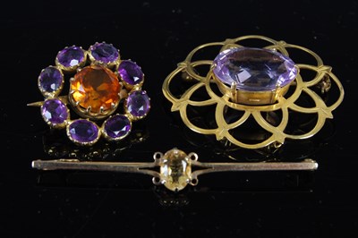 Lot 683 - A group of three brooches, to include a 9ct...