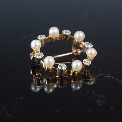 Lot 708 - An Edwardian diamond & pearl small open-centre...