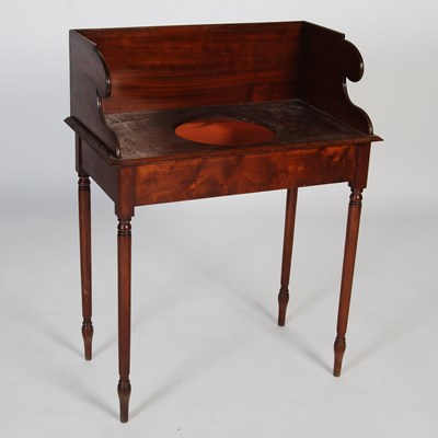 Lot 18 - A 19th century mahogany washstand, the...