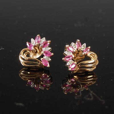 Lot 659 - A pair of ruby and diamond earrings, each set...