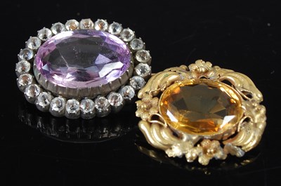 Lot 654 - A Victorian oval amethyst brooch with clear...