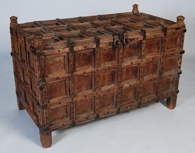 Lot 103 - An Eastern hardwood and iron-bound dowry chest,...