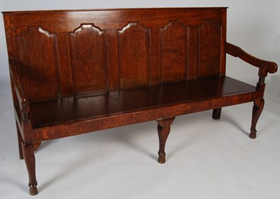 Lot 117 - A George III oak hall settle/bench, the...