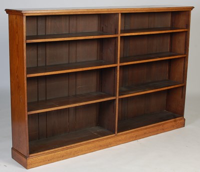 Lot 88 - An early 20th century oak open bookcase,...