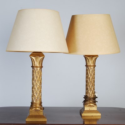 Lot 142 - A pair of gilt composite table lamps and...