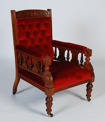 Lot 29 - A Victorian oak armchair, with red button-down...