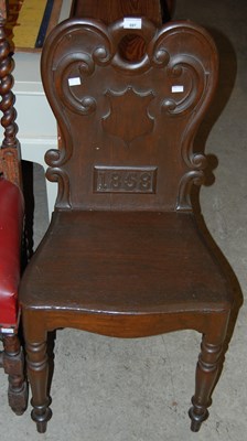 Lot 697 - A Victorian oak hall chair, dated 1858, with...