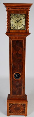 Lot 5 - A walnut oyster veneered longcase clock in the...