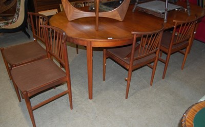 Lot 726 - A mid-century teak circular extending dining...