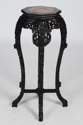 Lot 85 - A Chinese darkwood octagonal-shaped urn stand,...