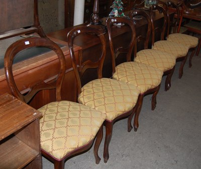 Lot 699 - A set of six balloon back chairs with yellow...