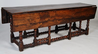 Lot 137 - An antique oak wake table, the rectangular top...