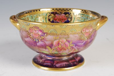 Lot 777 - A Maling purple ground twin handled lustre...