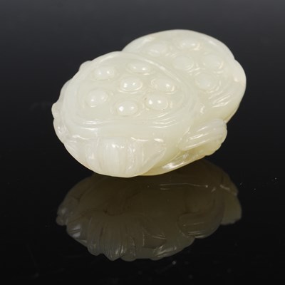 Lot 836 - A Chinese pale celadon jade double lotus...