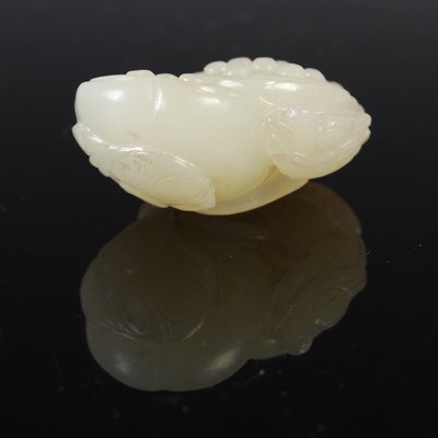 Lot 836 - A Chinese pale celadon jade double lotus...
