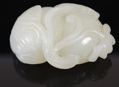 Lot 836 - A Chinese pale celadon jade double lotus...