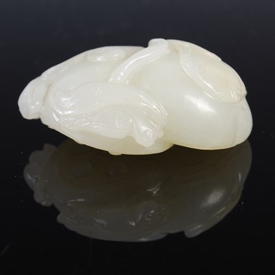 Lot 836 - A Chinese pale celadon jade double lotus...
