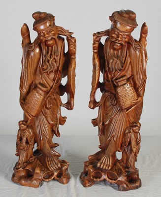 Lot 844 - A pair of Chinese carved wood figures of...