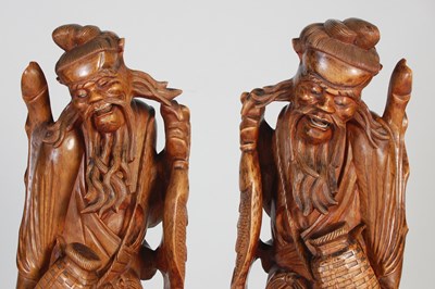 Lot 844 - A pair of Chinese carved wood figures of...