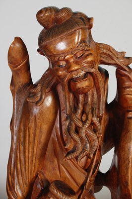Lot 844 - A pair of Chinese carved wood figures of...