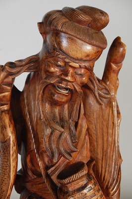 Lot 844 - A pair of Chinese carved wood figures of...