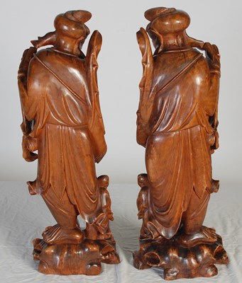 Lot 844 - A pair of Chinese carved wood figures of...