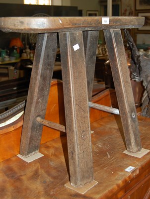 Lot 733 - An early 20th century dark wood four-legged...