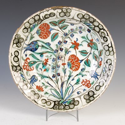Lot 875 - A fine large Turkish Iznik pottery charger,...