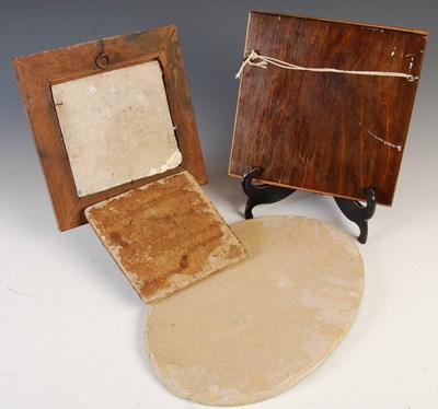 Lot 887 - A group of four Persian Qajar pottery tiles,...