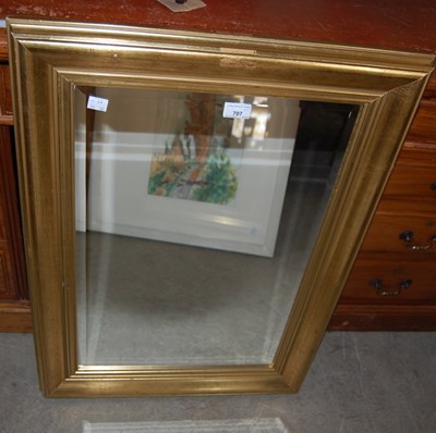 Lot 707 - A gilt framed rectangular bevelled mirror...