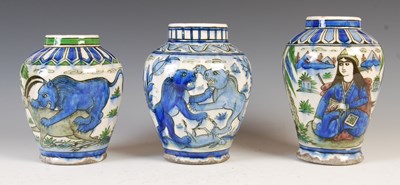 Lot 890 - Three assorted Persian Qajar pottery jars,...