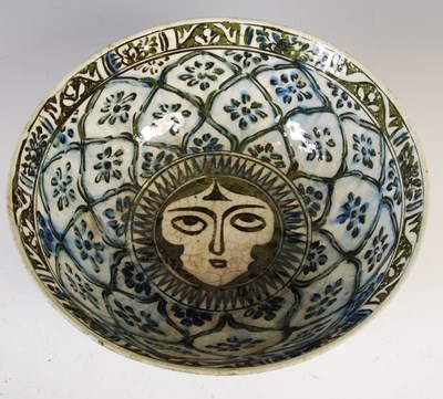 Lot 470 - A large Qajar Persian pottery bowl by Mirza...