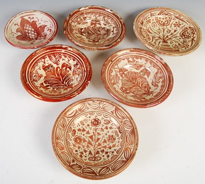 Lot 911 - A group of six Spanish Hispano-Moresque...