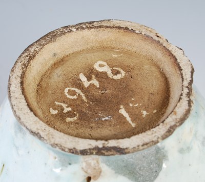Lot 879 - A Persian pottery blue and white vase, 19th...