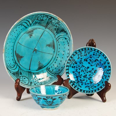 Lot 893 - A group of Damascus, Qajar pottery turquoise...