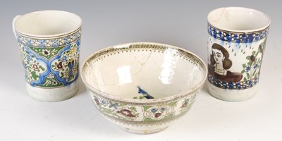 Lot 894 - A group of three Persian Qajar pottery vessels,...