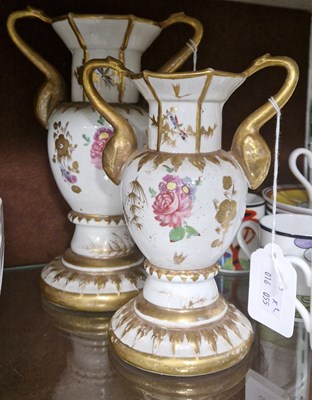 Lot 4 - Two graduated twin-handled porcelain vases,...