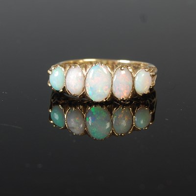 Lot 42 - A 9ct gold and opal five stone ring, size O,...