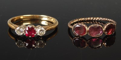 Lot 48 - A yellow and white metal three stone ruby and...