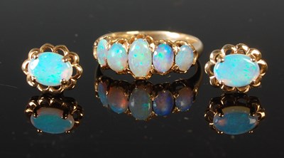 Lot 59 - A yellow metal and opal five stone ring, size...