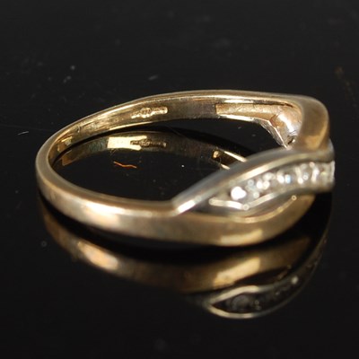 Lot 66 - A 9ct gold and nine stone diamond chip ring,...