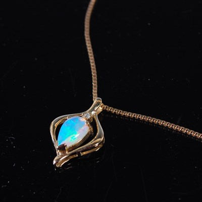 Lot 67 - A 9ct gold, opal and diamond chip pendant,...