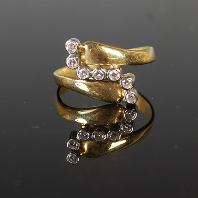 Lot 71 - A yellow and white metal seven stone diamond...