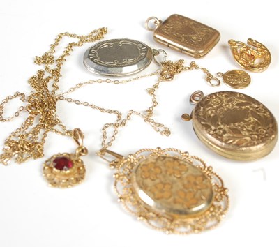 Lot 76 - A 9ct gold oval locket and yellow metal chain,...